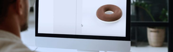 A user creating a photorealistic rendering of a donut using SOLIDWORKS Visualize on a computer screen