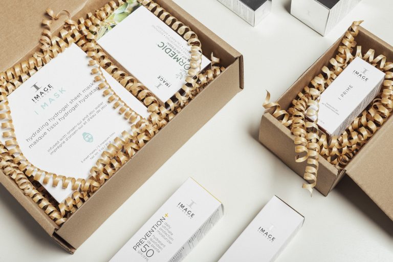 RAIKU's spiral, compostable packaging material in boxes protecting luxury cosmetics