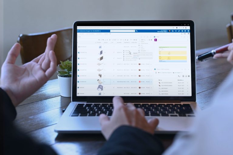 A laptop open to 3DEXPERIENCE with a mouse clicking on subscribe